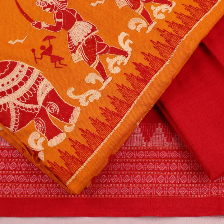 Close-up of Sambalpuri dress material blouse piece in yellow base with red doll motifs