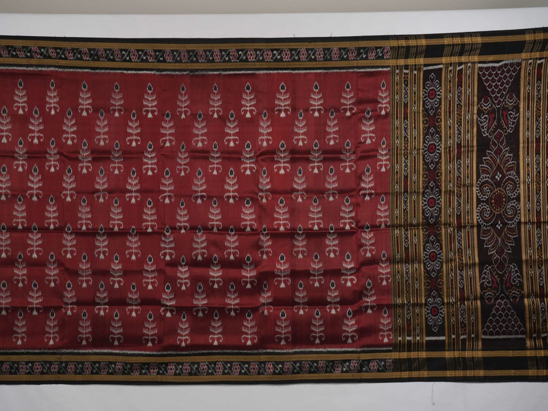 Full styling view of an elegant brown and black Khandua silk saree draped on a model for a classic look.