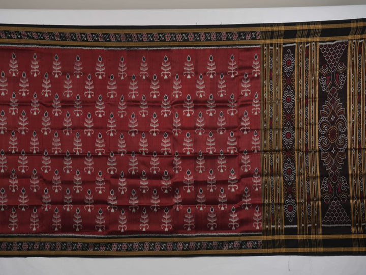 Full styling view of an elegant brown and black Khandua silk saree draped on a model for a classic look.