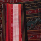 Saree styling: White and black Sambalpuri cotton saree with motifs, draped to showcase the overall look.