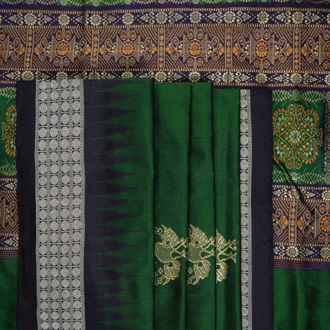 Close-up of Bomkai silk saree fabric, revealing rich texture and intricate handloom weave details.