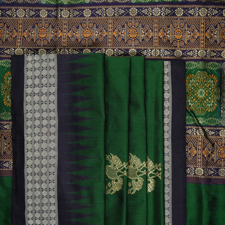 Close-up of Bomkai silk saree fabric, revealing rich texture and intricate handloom weave details.