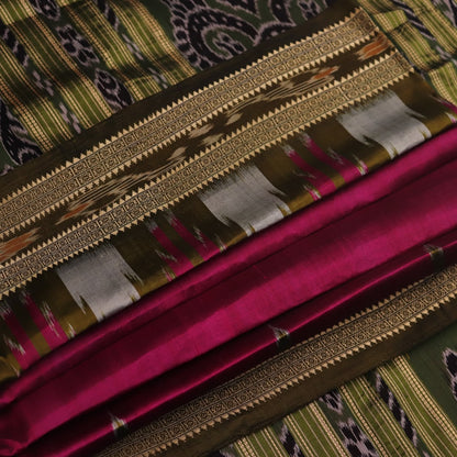 Magenta Khandua silk saree styled; green blouse accentuates the butta pattern and rich drape.