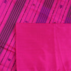 Close-up of plain peach and pink Sambalpuri silk saree fabric texture.