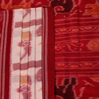 Full view of a white and red Sambalpuri cotton saree with traditional motifs.