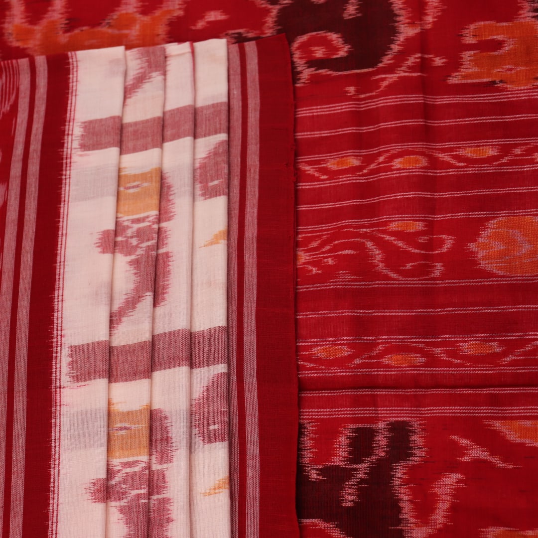 Full view of a white and red Sambalpuri cotton saree with traditional motifs.