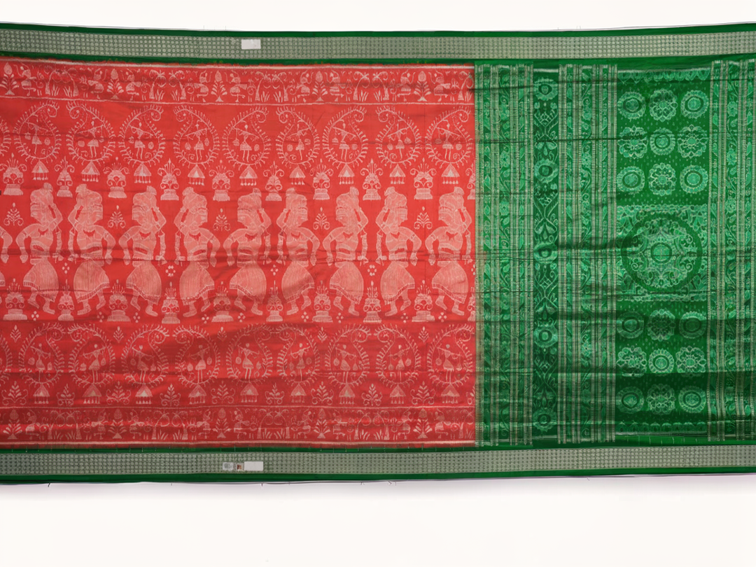 Close-up of the smooth, rich silk texture of the peach Sambalpuri saree with fine motifs.