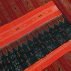 Green and orange Sambalpuri cotton saree draped, showcasing the motif pattern.