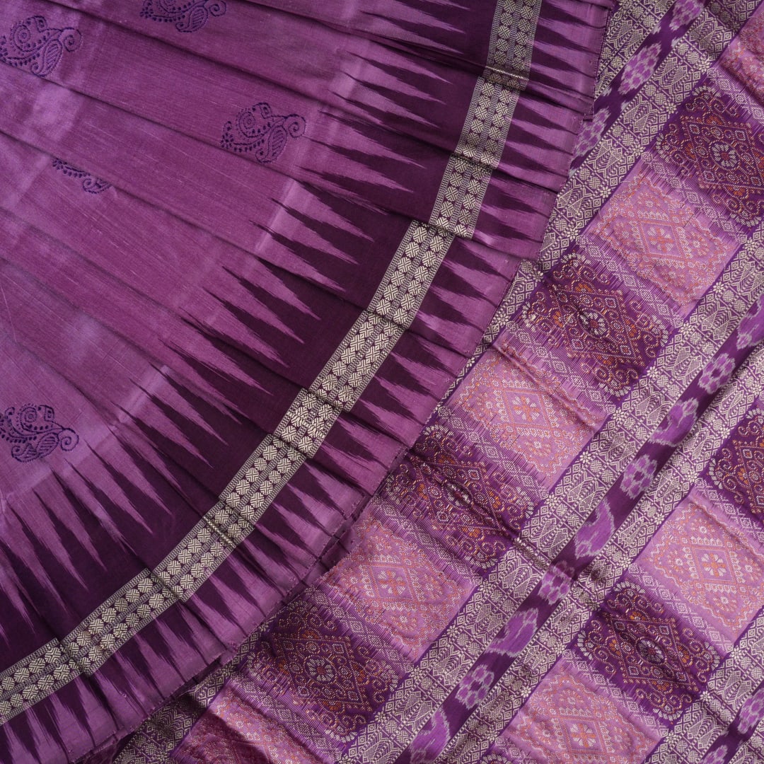 Close-up of purple Bomkai Silk Saree fabric, revealing its luxurious silk texture and exquisite handloom weave.