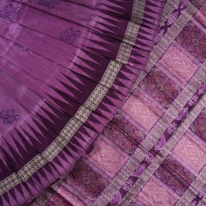 Close-up of purple Bomkai Silk Saree fabric, revealing its luxurious silk texture and exquisite handloom weave.