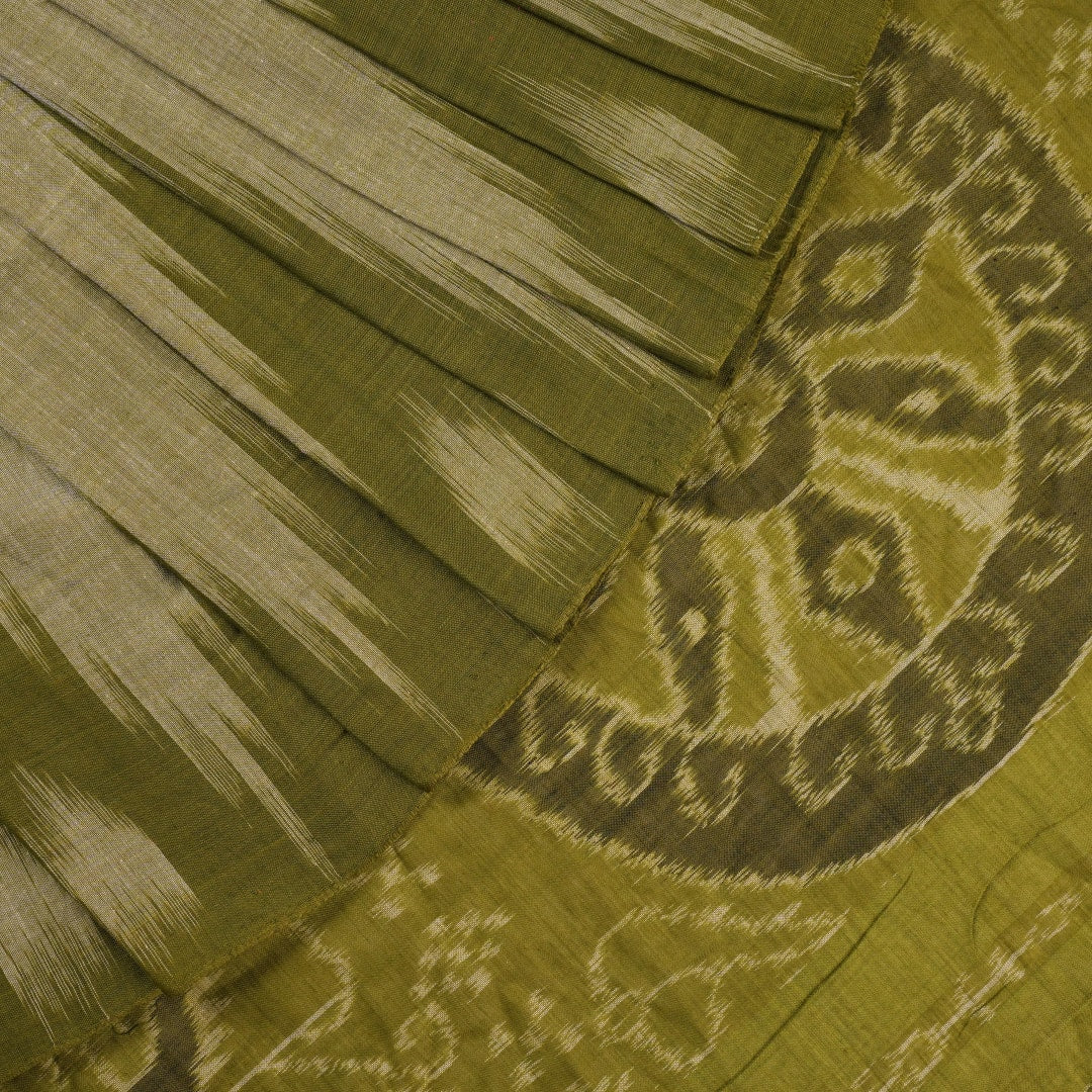 Full styling view of a model draped in a plain green Sambalpuri cotton saree with traditional accents.