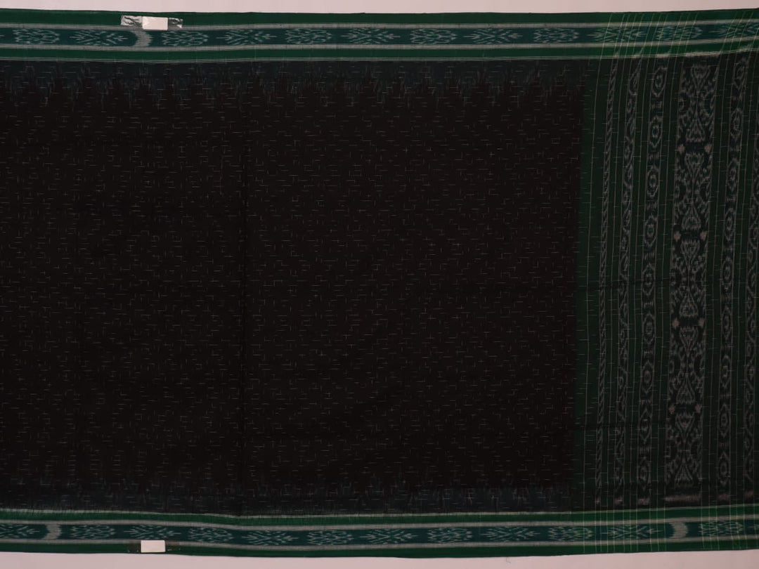 Black and green plain Sambalpuri cotton saree, gracefully draped.