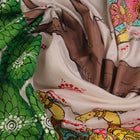 Close-up of white silk Patachitra saree fabric showing hand-painted texture and detail.