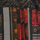 Close-up of the luxurious black Sambalpuri silk fabric, highlighting its rich texture and weave.