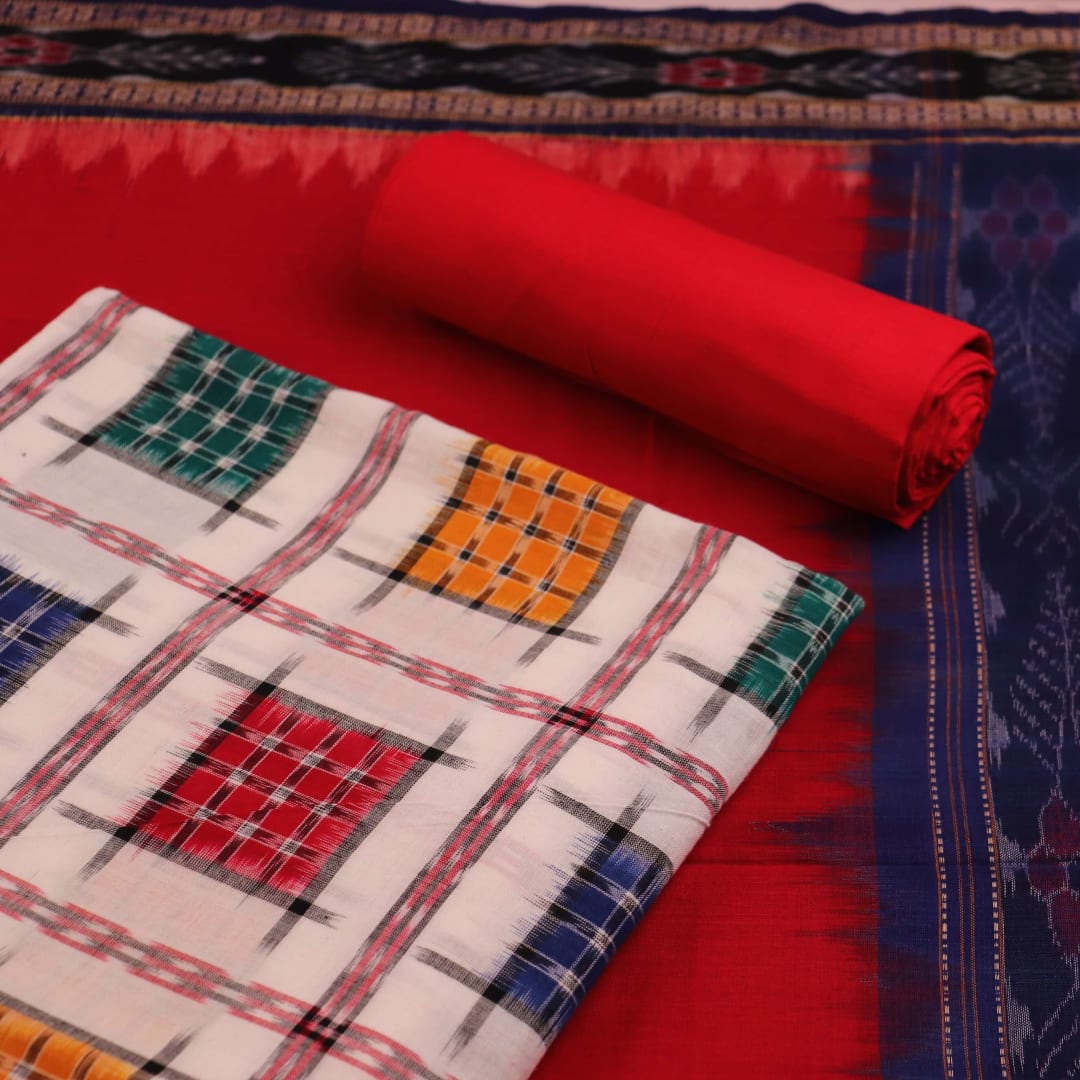 Close-up of white cotton Sambalpuri dress material with red motifs