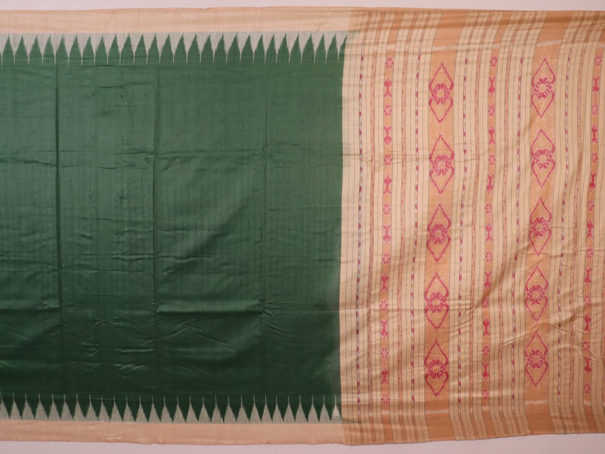 Close-up of the green and off-white plain Tussar silk saree, highlighting its natural slub texture.