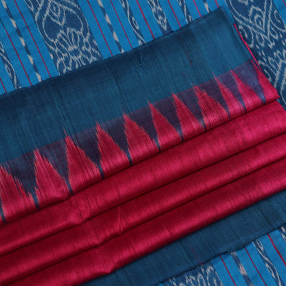 Close-up shot showcasing the textured weave of the tussar silk fabric of a plain pink and blue saree.
