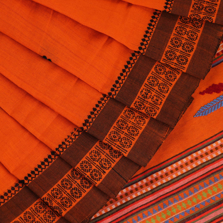 Full-length view of an orange cotton Berhampuri saree with a butta pattern and broad orange borders.