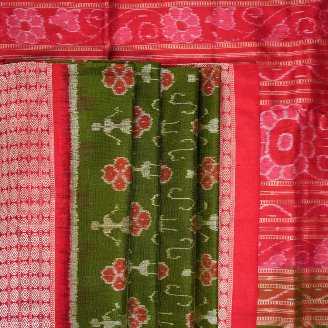 Close-up showing the rich, smooth texture of the green Sambalpuri Silk Saree's weave, highlighting its quality.
