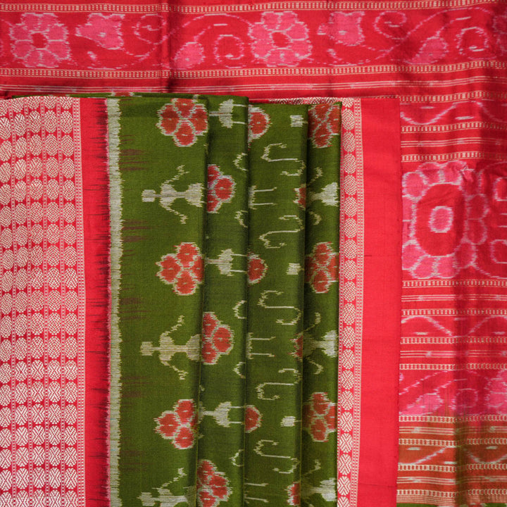 Close-up showing the rich, smooth texture of the green Sambalpuri Silk Saree's weave, highlighting its quality.