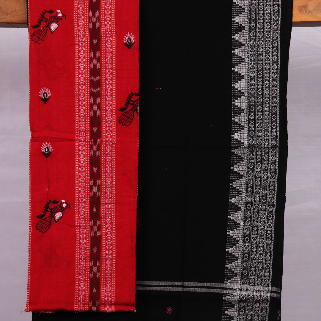 Close-up of red cotton Sambalpuri dress material with intricate black motifs