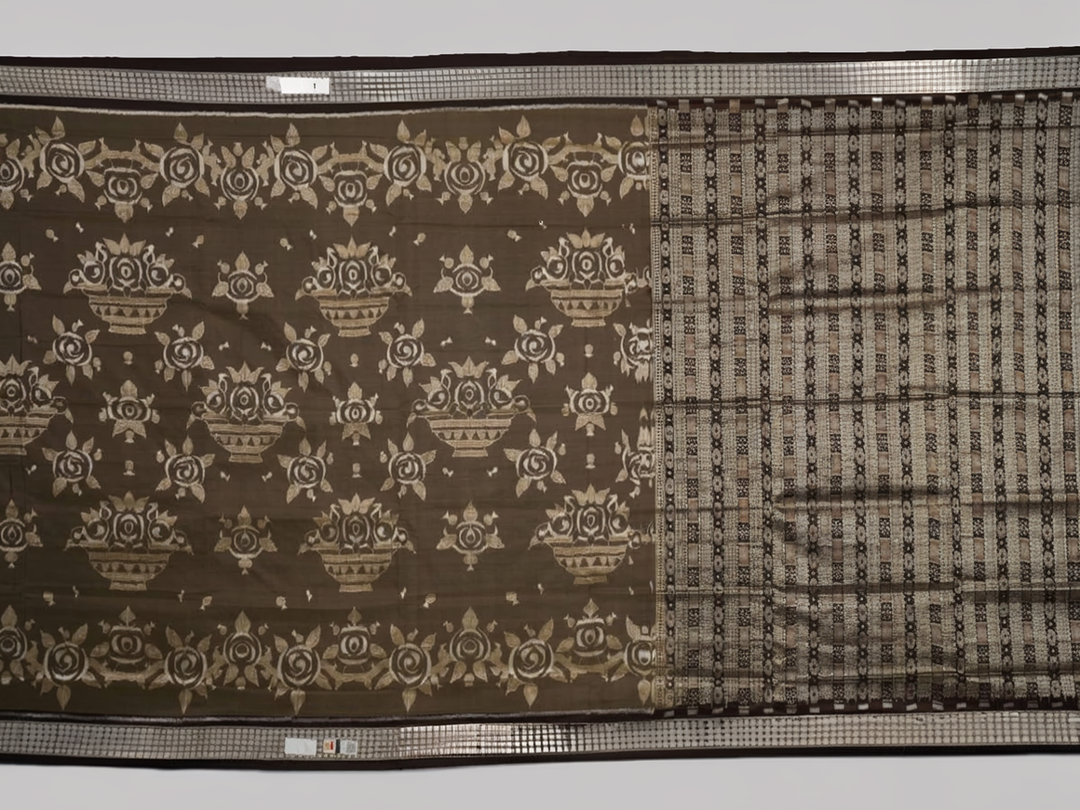 Close-up of the grey and black Sambalpuri Silk Saree fabric, highlighting its rich silk texture and weave.