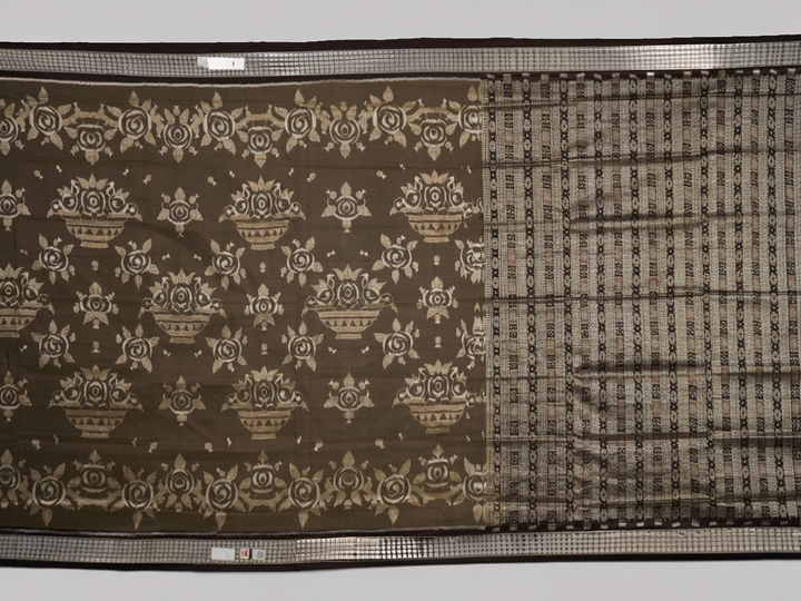 Close-up of the grey and black Sambalpuri Silk Saree fabric, highlighting its rich silk texture and weave.