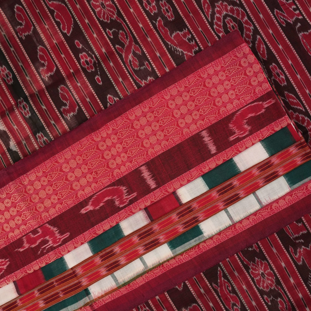 Model draped in a green and maroon pasapalli Sambalpuri cotton saree for a traditional ethnic look.