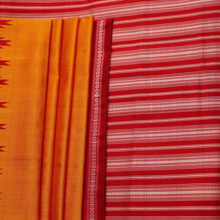 Close-up view of the smooth and lustrous silk fabric texture in a plain yellow Berhampuri saree.