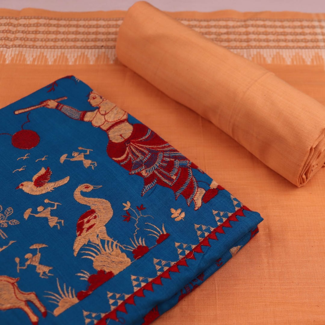 Close-up of the blouse piece showcasing the Doll pattern in blue and brown on cotton fabric.