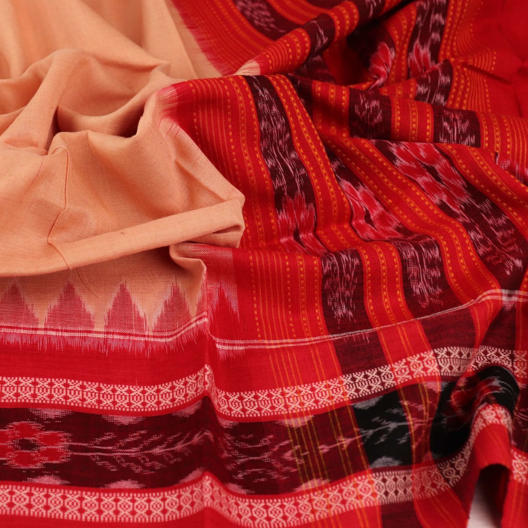 Cream-colored cotton Sambalpuri dupatta with red plain body and contrasting border, elegantly draped