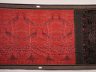Full layout view of a rust and black Sambalpuri cotton saree displaying the complete body pattern and motifs.
