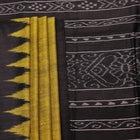 Close-up of the plain, slubby texture of a handwoven green and black Tussar silk saree.