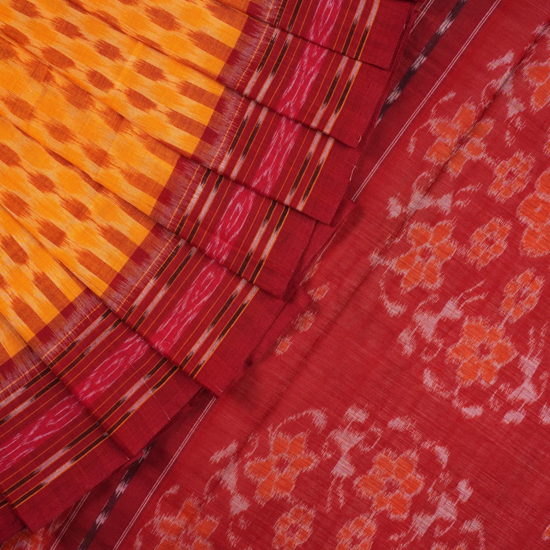 Full styling view of a model draped in a yellow and maroon Sambalpuri cotton saree with motifs.