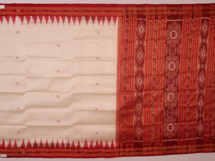 Khandua silk saree styled; white with red butta design, showcasing drape and overall look.