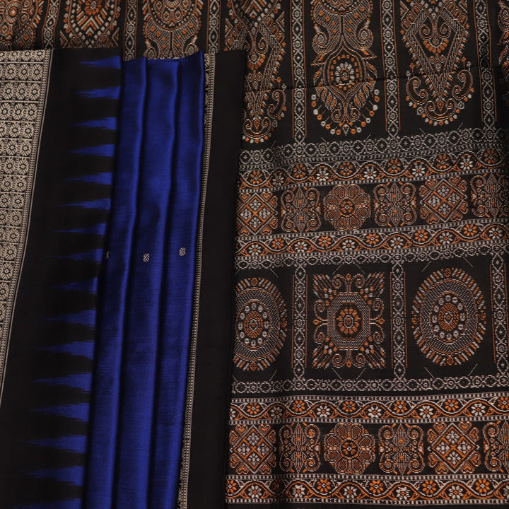 Close-up of the intricate woven texture of blue and black Bomkai silk saree with butta.