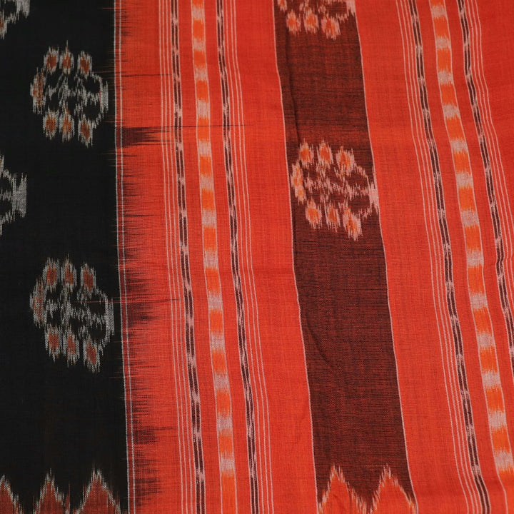 Black cotton Sambalpuri dupatta with rust motifs, styled on a mannequin