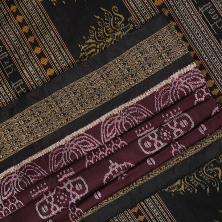 Micro close-up of the maroon Sambalpuri silk fabric, revealing its luxurious texture and handloom weave.