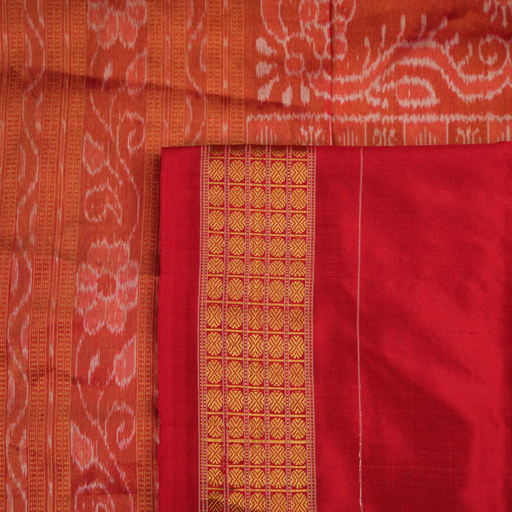 Close-up of Sambalpuri silk saree fabric, revealing rich texture, weave, and subtle tissue motifs.