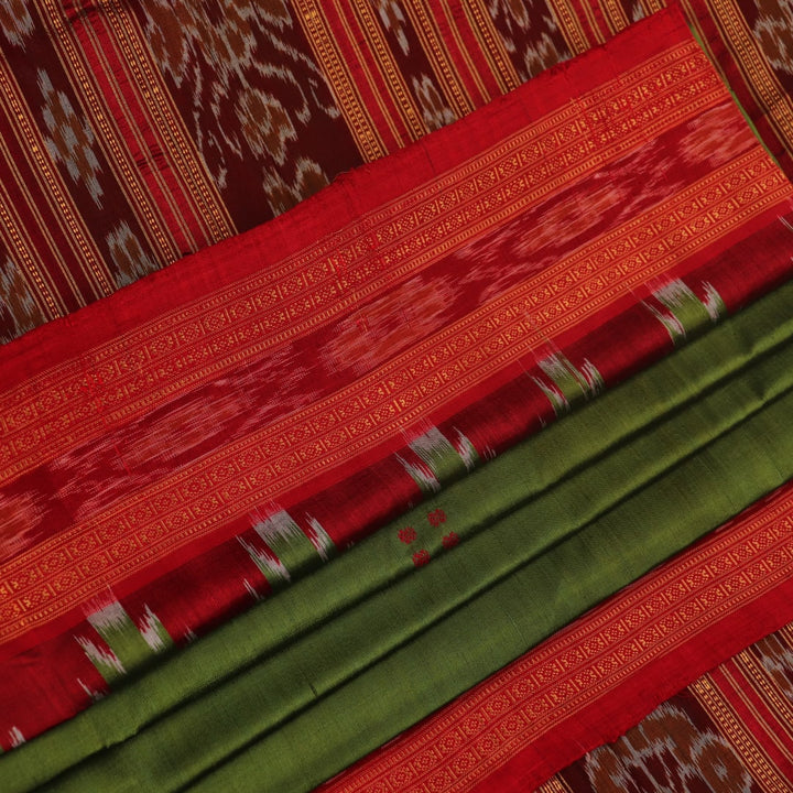 Green Khandua silk saree draped, showcasing its butta pattern and red accents.
