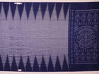 Blue plain Sambalpuri cotton saree styled, highlighting its simple elegance and drape.