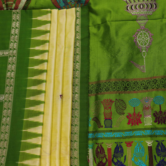 Close-up of cream and green Bomkai Silk Saree fabric texture with butta pattern.