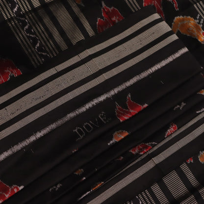 Close-up of the textured silk fabric of a black Sambalpuri saree showing intricate motifs.