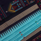 Close-up of light and dark blue silk fabric with intricate butta pattern woven in
