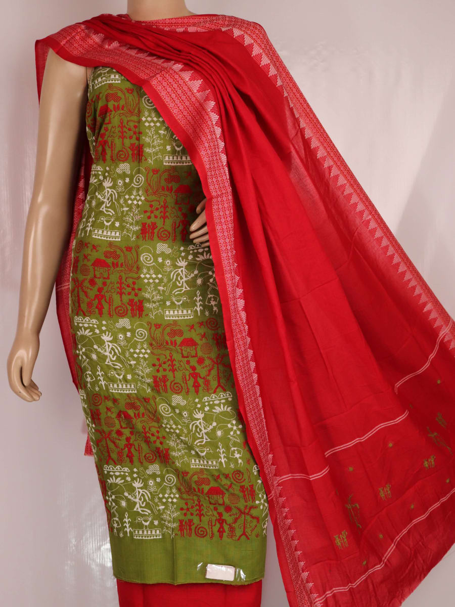 Close-up of a green cotton Sambalpuri dress material with a red doll pattern blouse piece.