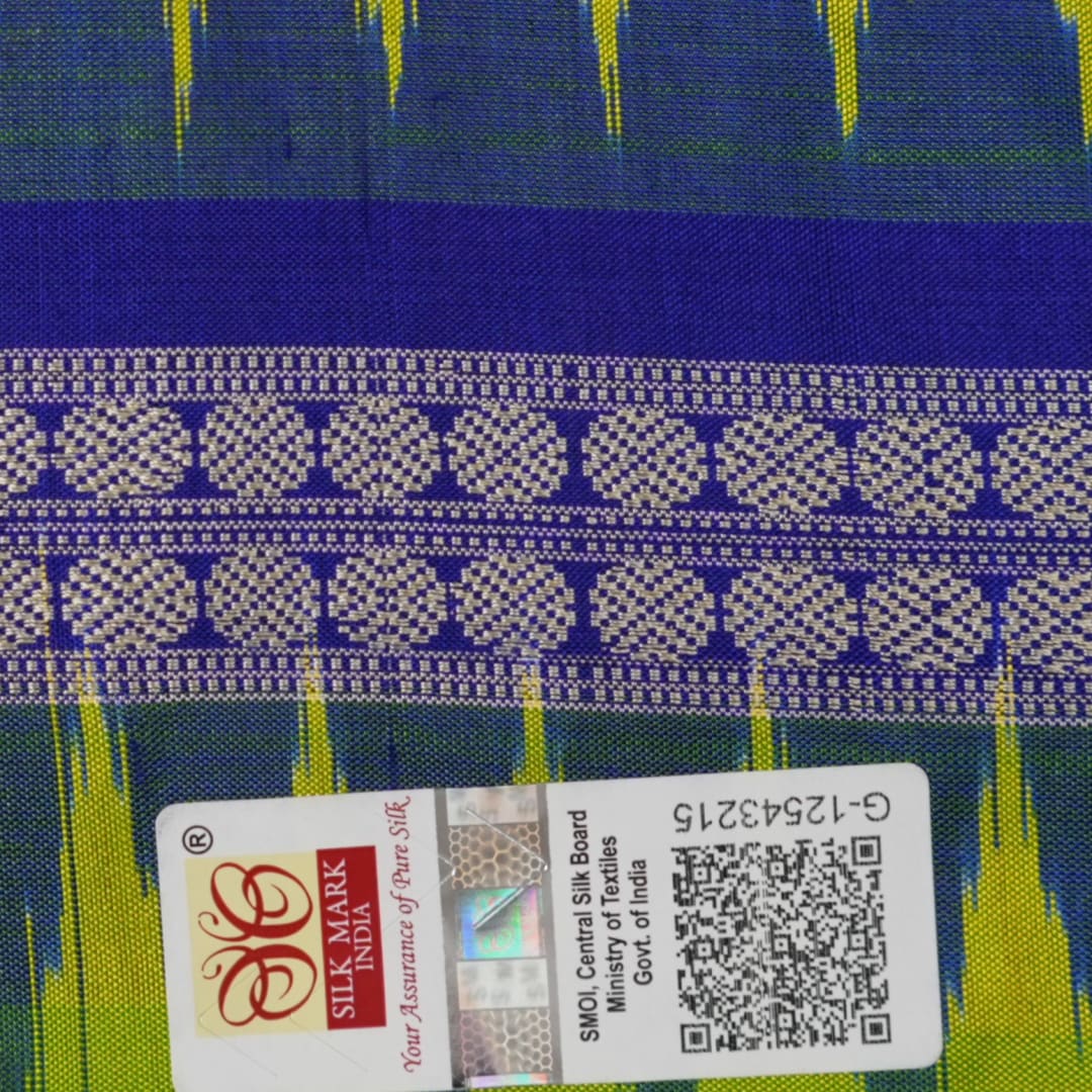 Detailed close-up of the exquisite green Bomkai Silk Saree fabric, highlighting its luxurious silk weave.