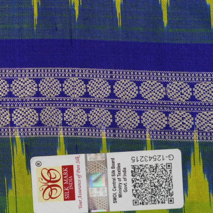 Detailed close-up of the exquisite green Bomkai Silk Saree fabric, highlighting its luxurious silk weave.