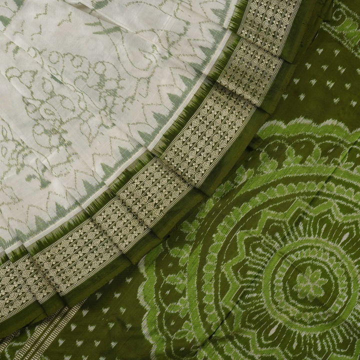 Close-up of the luxurious texture of the white Sambalpuri Silk Saree, revealing the fine weave and motif details.