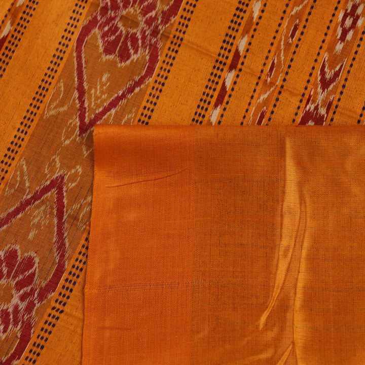 Close-up showcasing the intricate blue tussar silk fabric with a plain pattern and yellow accent hues.