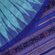 Close-up of plain blue Sambalpuri silk handloom saree fabric texture.